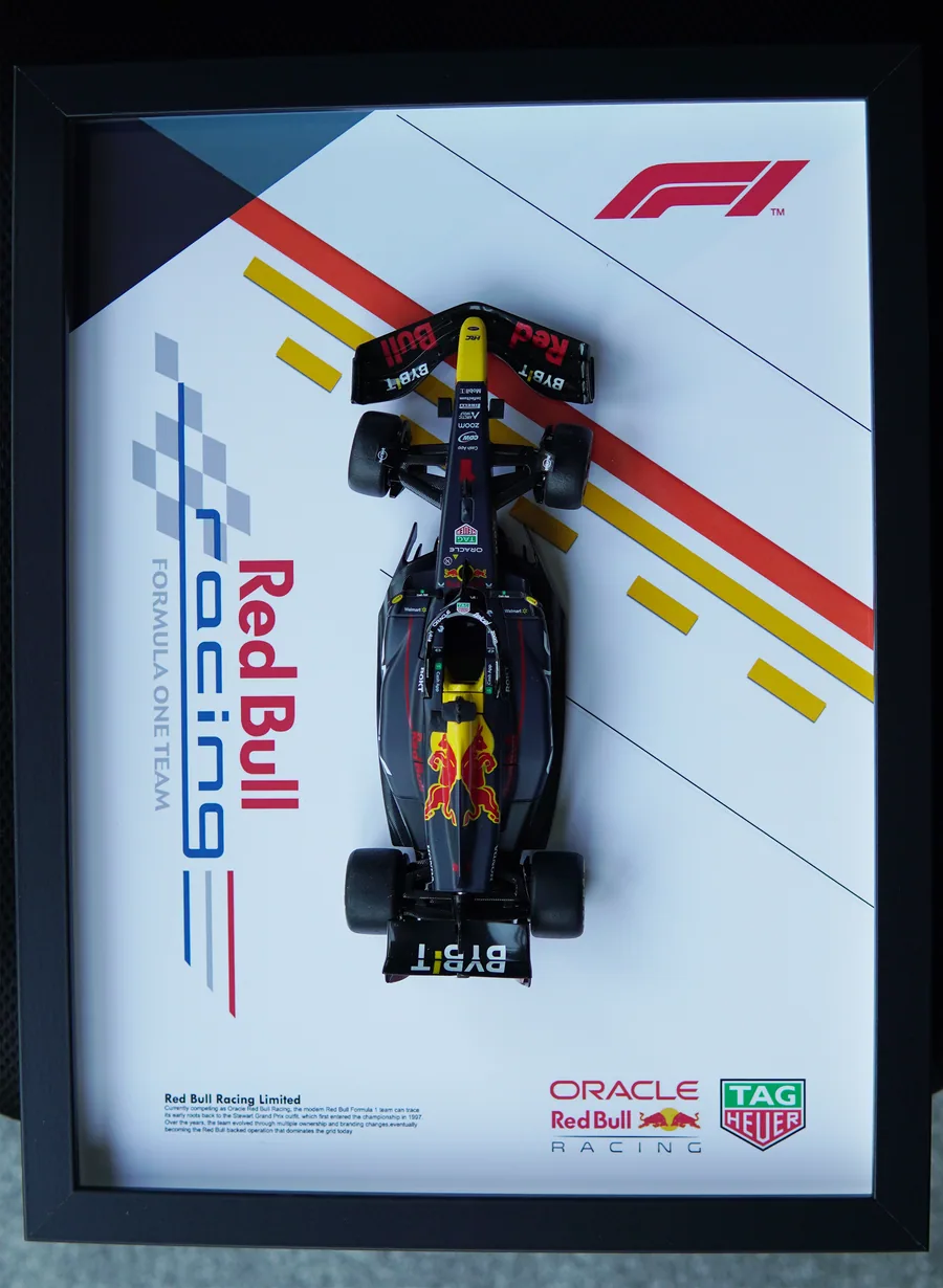 Red Bull RB19 Formula One diecast car in a black shadow box frame
